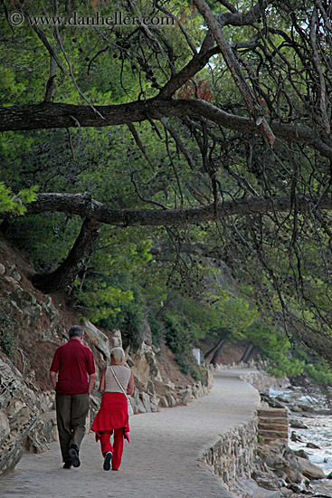 couple-walking-by-trees-n-water-1.jpg