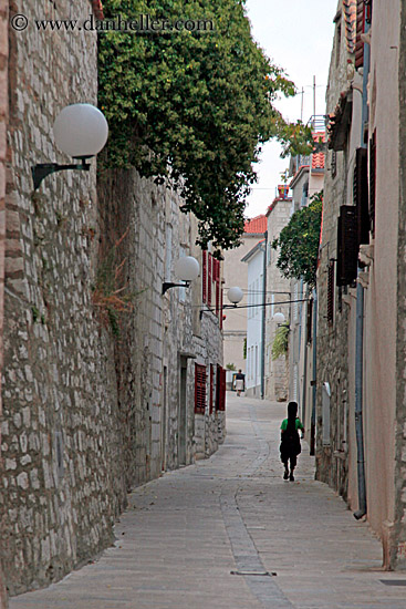 musician-walking-narrow-street.jpg