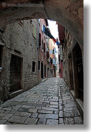 archways, clothes, cobblestones, croatia, europe, hangings, laundry, materials, narrow, narrow streets, rovinj, stones, streets, structures, vertical, photograph