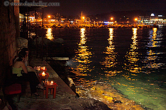 couple-dining-by-water-at-nite.jpg
