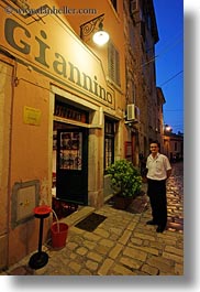 croatia, europe, giannino, narrow streets, restaurants, rovinj, streets, vertical, waiter, photograph