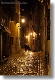 cobblestones, couples, croatia, europe, materials, narrow streets, rovinj, stones, streets, vertical, walking, photograph