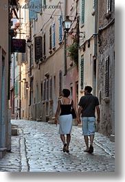 cobblestones, conceptual, couples, croatia, emotions, europe, materials, narrow streets, romantic, rovinj, stones, streets, vertical, walking, photograph