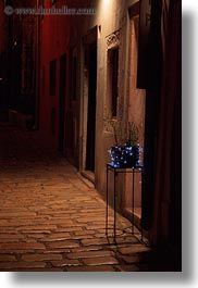 cobblestones, croatia, europe, illuminated, materials, narrow streets, nite, planter, rovinj, stones, streets, vertical, photograph