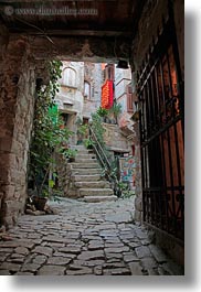 archways, cobblestones, croatia, europe, materials, narrow, narrow streets, rovinj, stones, streets, under, vertical, photograph