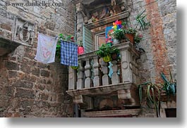 balconies, croatia, europe, flowers, horizontal, laundry, stones, trogir, photograph
