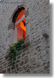 archways, croatia, europe, geraniums, glow, gothic, lights, perspective, structures, trogir, upview, vertical, windows, photograph