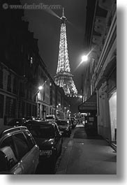 black and white, buildings, cars, eifeel, eiffel tower, europe, france, glow, lights, paris, streets, structures, towers, vertical, photograph