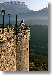 castles, chateau trigance, dawn, europe, france, lamps, materials, men, nature, people, provence, scenics, stones, vertical, photograph
