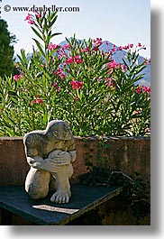 colors, europe, flowers, france, green, hotels, moustiers, nature, pink, provence, st marie, statues, stones, vertical, photograph