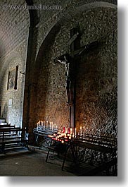 buildings, candles, churches, crosses, europe, france, materials, monestaries, moustiers, notre dame de beauvoir, provence, religious, st marie, stones, structures, vertical, photograph