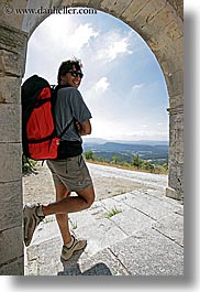 arches, archways, backpack, clothes, clouds, colors, europe, france, groups, men, nature, nicos, people, provence, red, sky, structures, sunglasses, vertical, photograph