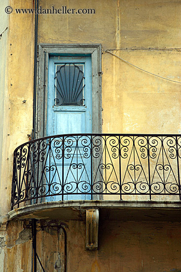 blue-door-balcony-n-yellow-stucco-wall.jpg