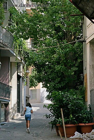 girl-running-on-street-by-trees.jpg