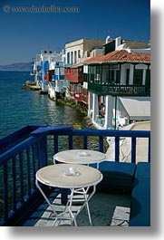 buildings, europe, greece, houses, mykonos, seaside, tables, vertical, waterfront, photograph