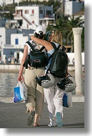 europe, greece, helmets, mykonos, people, vertical, walking, womens, photograph