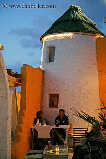 couple-dining-near-stucco-round-bldg.jpg