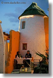 buildings, couples, dining, dusk, europe, greece, naxos, near, round, stucco, vertical, white wash, photograph