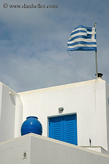 greek-flag-w-pot-on-stucco-bldg.jpg