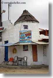 images/Europe/Greece/Naxos/Buildings/stucco-bldg-w-chairs-n-doors.jpg