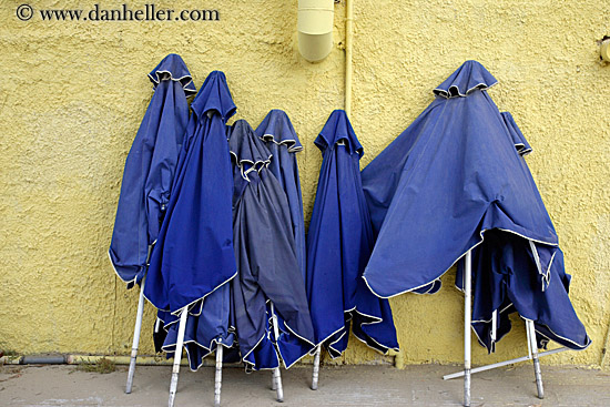 blue-umbrellas-yellow-wall.jpg