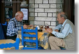 eating, europe, greece, horizontal, men, naxos, old, people, two, photograph