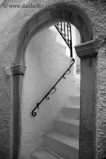 stairs-n-black-iron-railing-thru-arch-bw.jpg