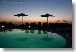 dusk, europe, greece, horizontal, hotels, pools, santorini, sunsets, swimming pool, umbrellas, photograph