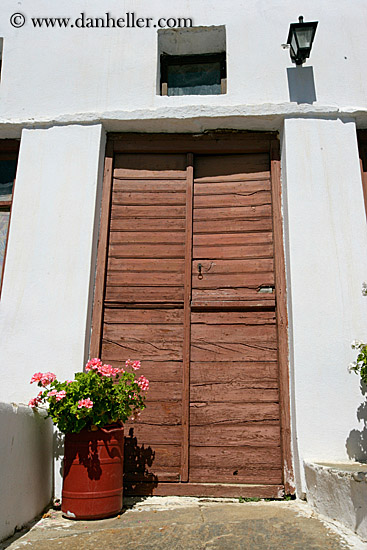 old-brown-wood-door-n-pink-geraniums.jpg