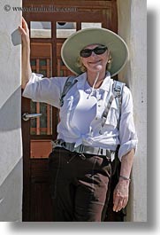 carol, clothes, doors, emotions, europe, greece, happy, hats, people, senior citizen, smiles, sunglasses, tourists, vertical, womens, photograph