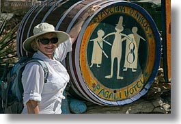 barrels, carol, clothes, emotions, europe, greece, happy, hats, horizontal, people, senior citizen, signs, smiles, sunglasses, tourists, womens, photograph