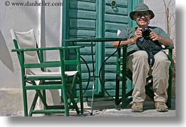 artists, cameras, chairs, clothes, emotions, europe, greece, green, happy, hats, horizontal, howard, men, people, photographers, senior citizen, sunglasses, tourists, photograph