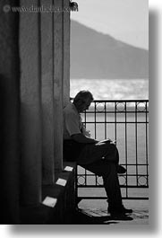 black and white, europe, greece, kostas, men, people, reading, tourists, vertical, photograph
