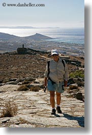 clothes, europe, greece, hats, hiking, men, ocean, old, people, roads, scenics, sunglasses, ted, ted eve, tourists, vertical, photograph