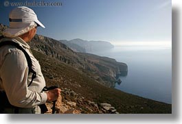 cliffs, clothes, europe, greece, hats, horizontal, looking, ocean, people, senior citizen, ted, ted eve, tourists, photograph