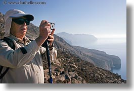 cameras, cliffs, clothes, emotions, europe, greece, hats, horizontal, people, senior citizen, serious, sunglasses, ted, ted eve, tourists, photograph