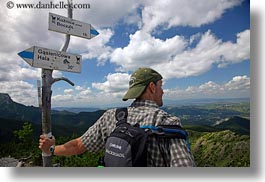 backpack, baseball cap, clothes, clouds, directional, europe, groups, hats, hikers, horizontal, hungary, landscapes, looking, men, nature, over, people, ron seely, signs, sky, tour guides, photograph