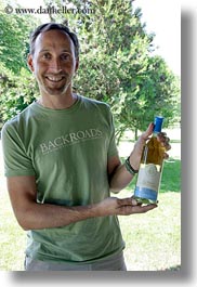 emotions, europe, foods, groups, happy, hungary, men, people, ron, ron seely, showing, smiles, tour guides, vertical, white wine, wine bottle, wines, photograph