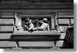 arts, black and white, blowing, budapest, cherub, europe, horizontal, horns, hungary, relief, stones, photograph