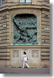 arts, budapest, cell phone, communist, europe, hungary, relief, vertical, walking, womens, photograph