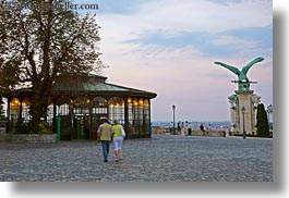 bronze, budapest, buildings, castle hill, europe, glasses, horizontal, hungary, materials, pedestrians, photograph