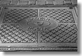 black and white, budapest, cobblestones, covers, europe, horizontal, hungary, irons, manhole covers, manholes, materials, photograph