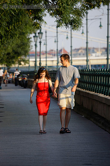 man-walking-w-woman-in-red-dress.jpg
