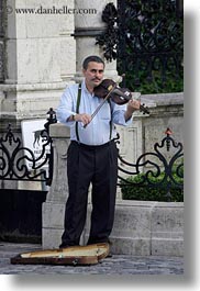 artists, budapest, europe, hungary, instruments, men, music, musicians, people, vertical, violinists, violins, photograph