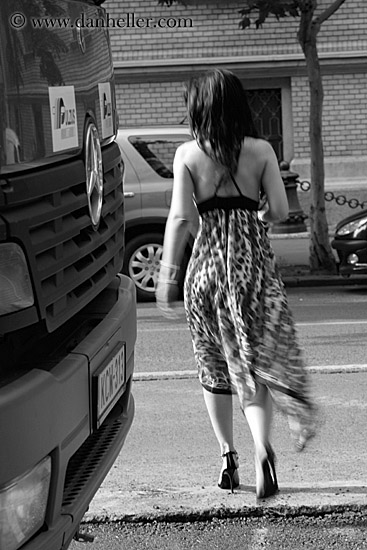 woman-walking-by-bus-bw-2.jpg