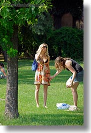 blonds, breasts, budapest, clothes, colors, europe, green, hair, hungary, park, people, sunglasses, vertical, womens, photograph