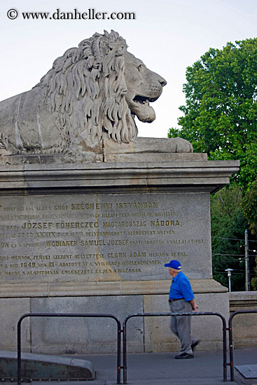 man-walking-by-lion-statue.jpg