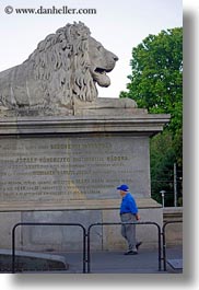 images/Europe/Hungary/Budapest/SzechenyiChainBridge/man-walking-by-lion-statue.jpg