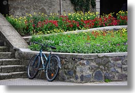 bicycles, bikes, europe, flowers, horizontal, hungary, stones, tarcal, walls, photograph