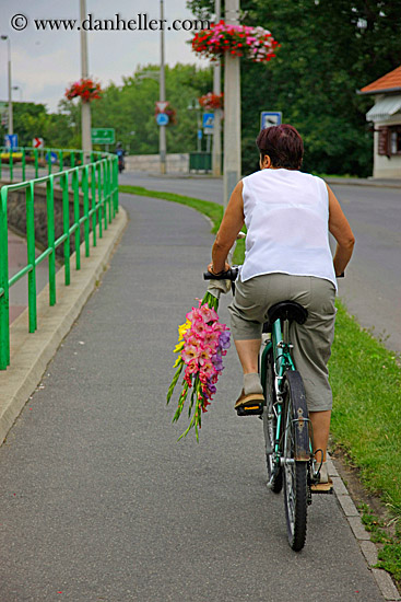 woman-riding-bike-w-flowers.jpg
